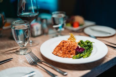 A beautifully plated fish meal with vegetables