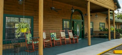 Porch area with rocking chairs at the facility entrance
