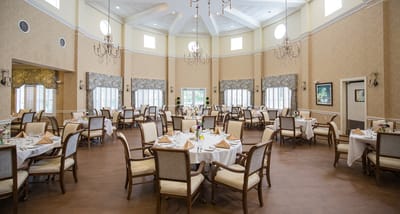 Bright dining room with elegantly set tables