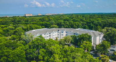 Aerial view of the facility surrounded by greenery
