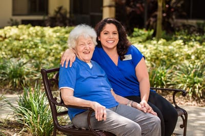 Resident and staff member enjoying time outdoors