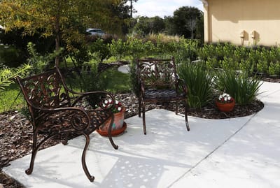 Outdoor seating area with landscaped garden