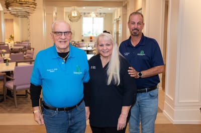 Staff members posing in a dining area