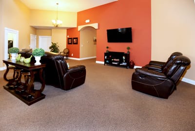 Cozy common area with seating and TV