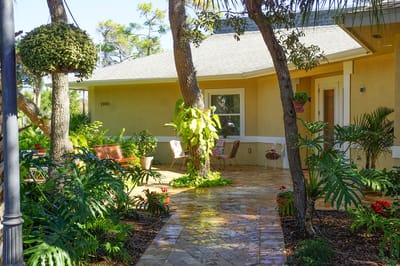 Well-maintained outdoor space with garden and seating
