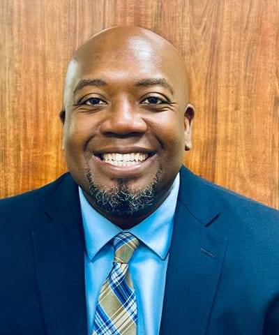 Smiling staff member in professional attire