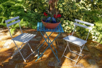 Cozy outdoor seating area with potted plants