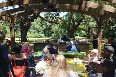 Residents enjoying an outdoor gathering with activities