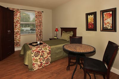 Cozy interior room with a bed and table
