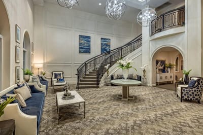 Lobby area with seating and a staircase