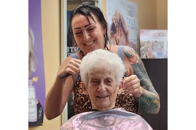 Resident getting a haircut in the salon