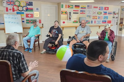 Residents participating in an indoor activity game