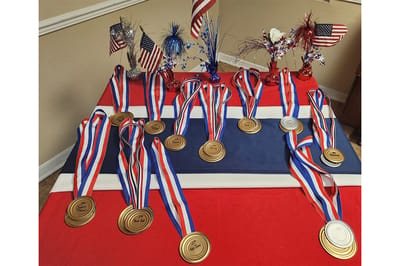 Display of medals and patriotic decorations on a table