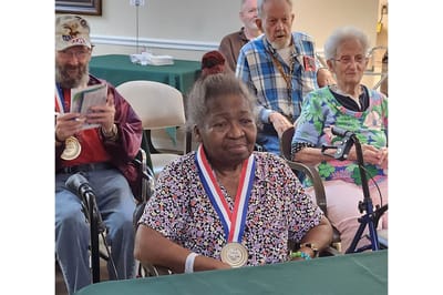 Residents participating in a medal ceremony event