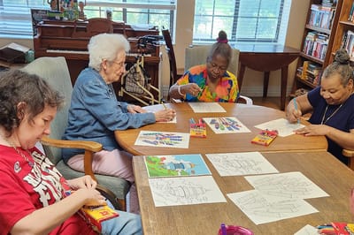 Residents engaged in a fun coloring activity
