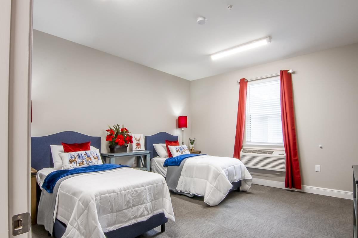 A cozy shared resident room with two beds