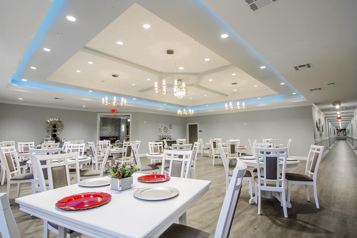 Bright dining room with tables and chairs set up for meals