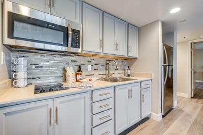Modern kitchen with stainless steel appliances and light colors