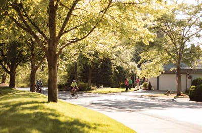 Residents enjoying a sunny day in a landscaped outdoor area