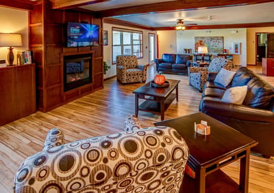 Common area lounge with comfortable seating and a fireplace
