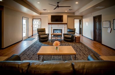 Interior common area with seating and a fireplace