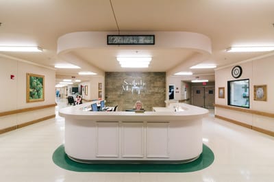 Reception area with a staff member at the desk