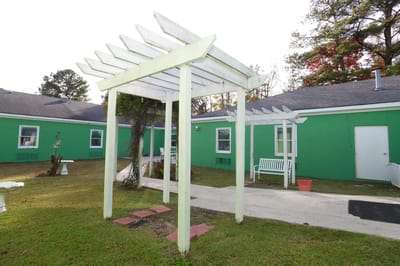 Outdoor seating area with a pergola in a garden