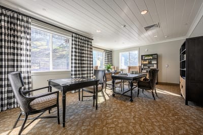 Bright common area with comfortable seating and large windows