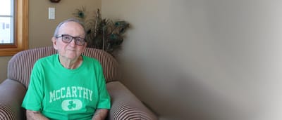 Elderly man sitting in a comfortable chair