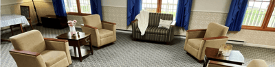 Bright common area with comfortable seating and decor