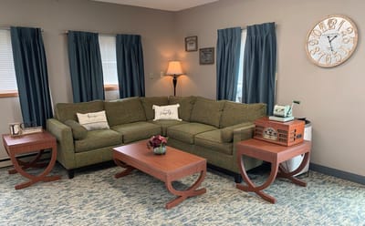 Cozy common area with a couch and decorative tables