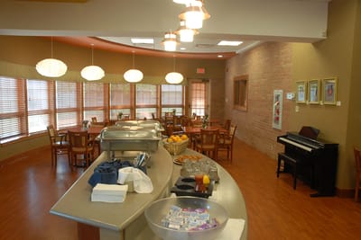 Dining area with tables and a buffet setup