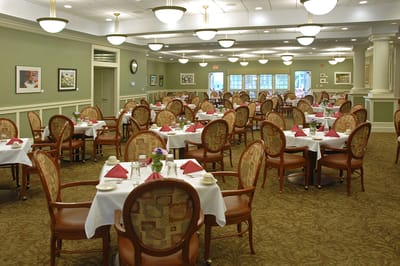 Dining area with tables set for residents