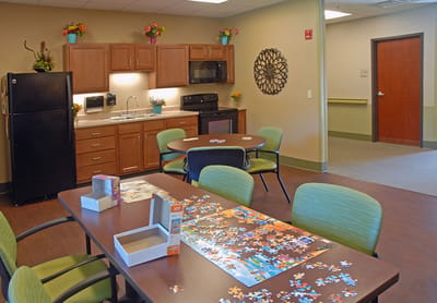 Bright puzzle room with tables and chairs
