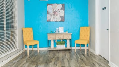 Bright and welcoming interior space with yellow chairs