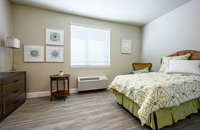 Cozy resident room with bed and decor