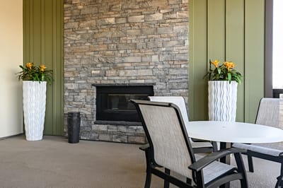 Outdoor patio area with seating and plants