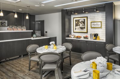 Bright dining area with visual interest and fruit display