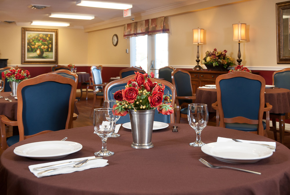 Dining room setup with elegant table decor and flowers
