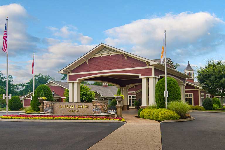 Exterior view of Life Care Center building with landscaping