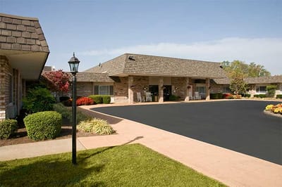 Exterior view of the assisted living facility with landscaping