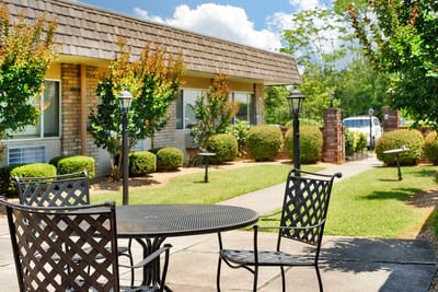 Outdoor seating area with well-maintained garden