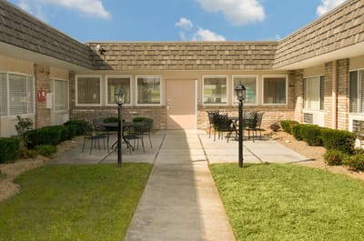 Outdoor courtyard with seating and landscaping