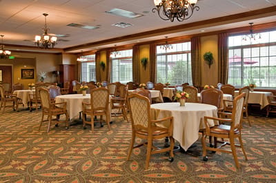Bright dining room with elegant decor and round tables