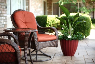 Cozy outdoor seating area with plants
