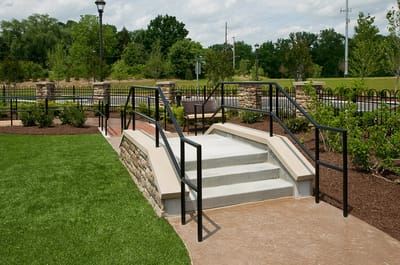 Accessible outdoor stairs leading to a landscaped area