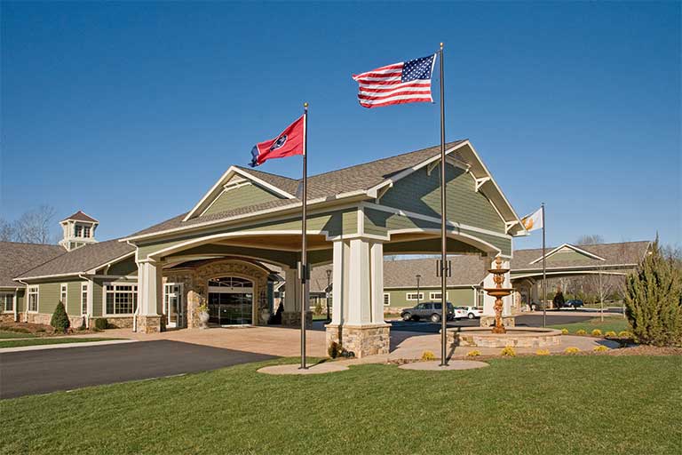 Exterior view of Life Care Center of Ooltewah with flags