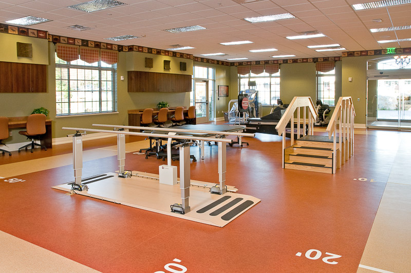 Interior rehabilitation area with equipment and seating