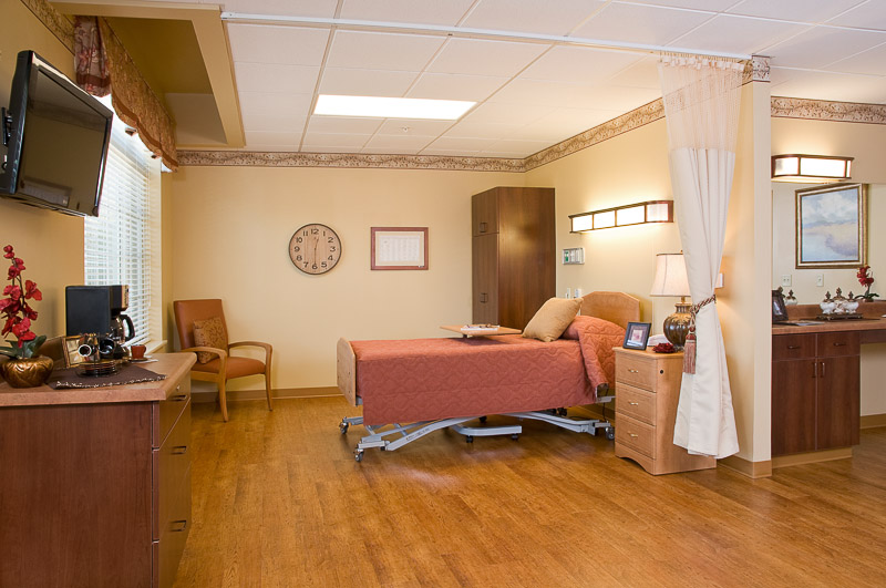 Private resident room with bed and furnishings