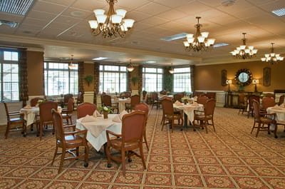 Dining area with tables and chairs, no people present